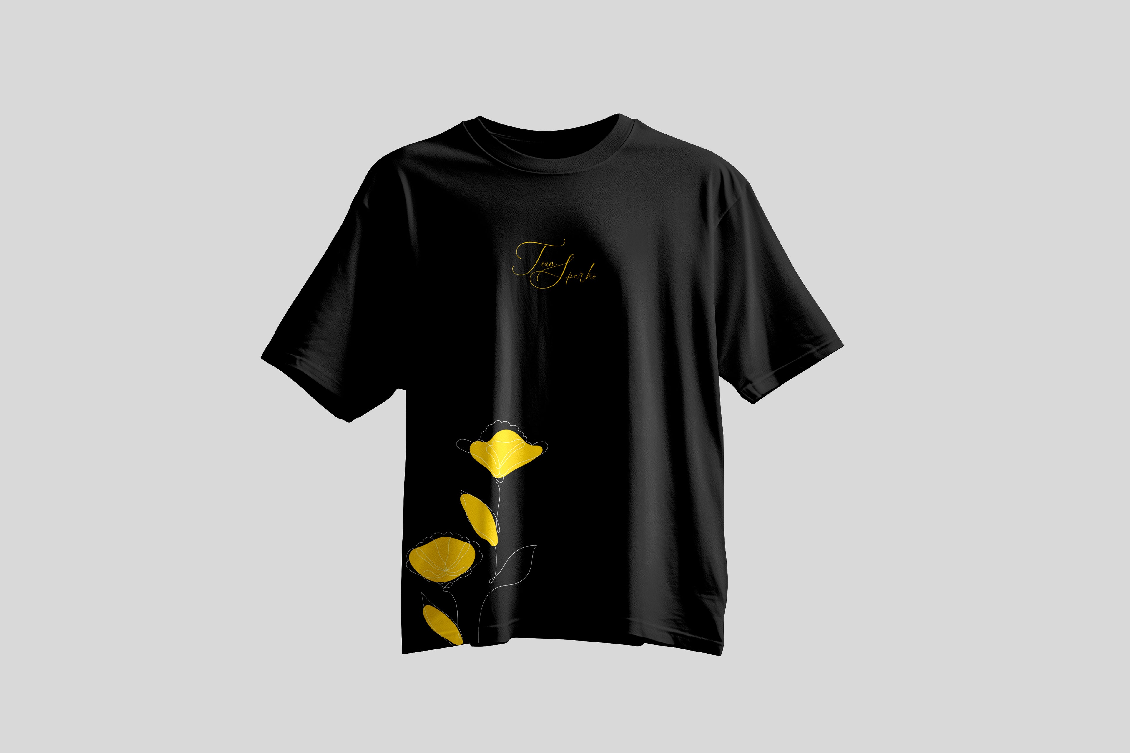 Black t-shirt with yellow abstract designs on a light gray background